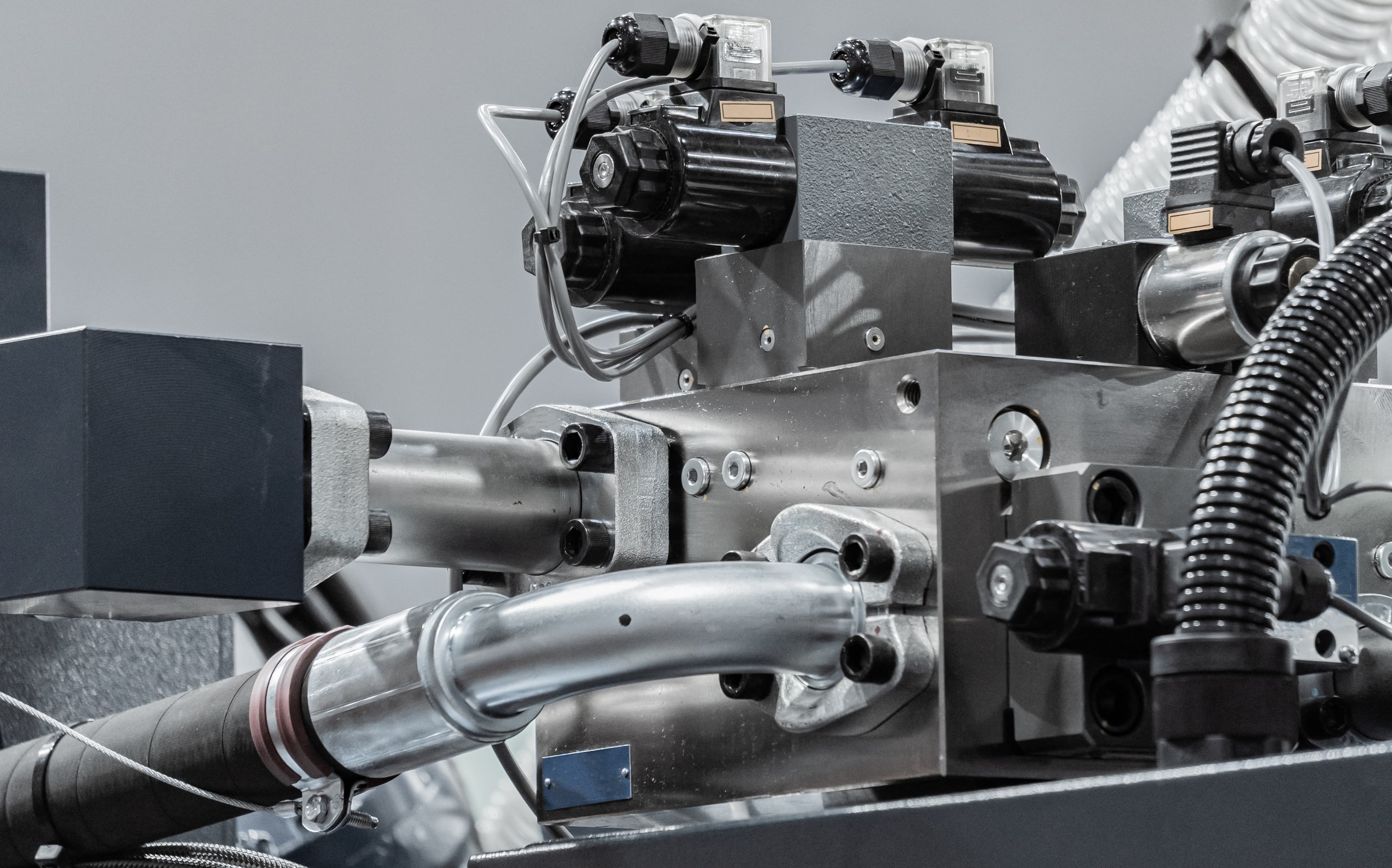 Detailed view of hydraulic production equipment and piping
